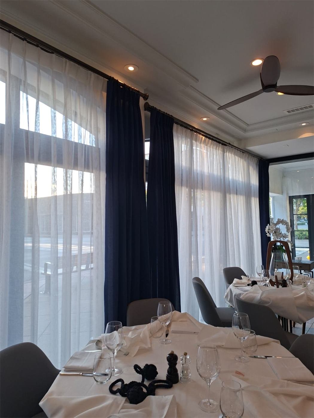 Floor-length drapes and sheers in a Miami dining room, cleaned in place