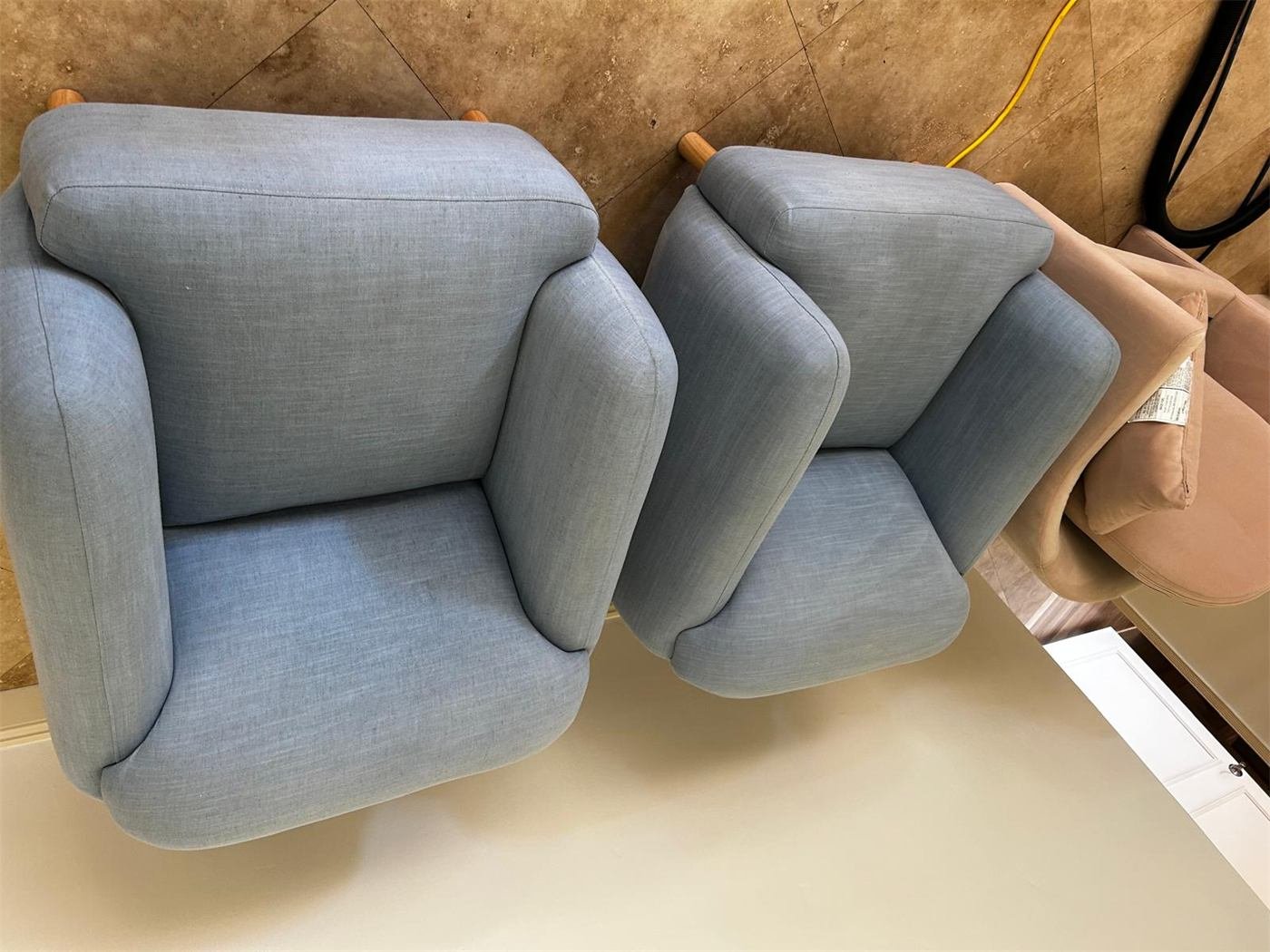 Two upholstered armchairs after furniture cleaning
