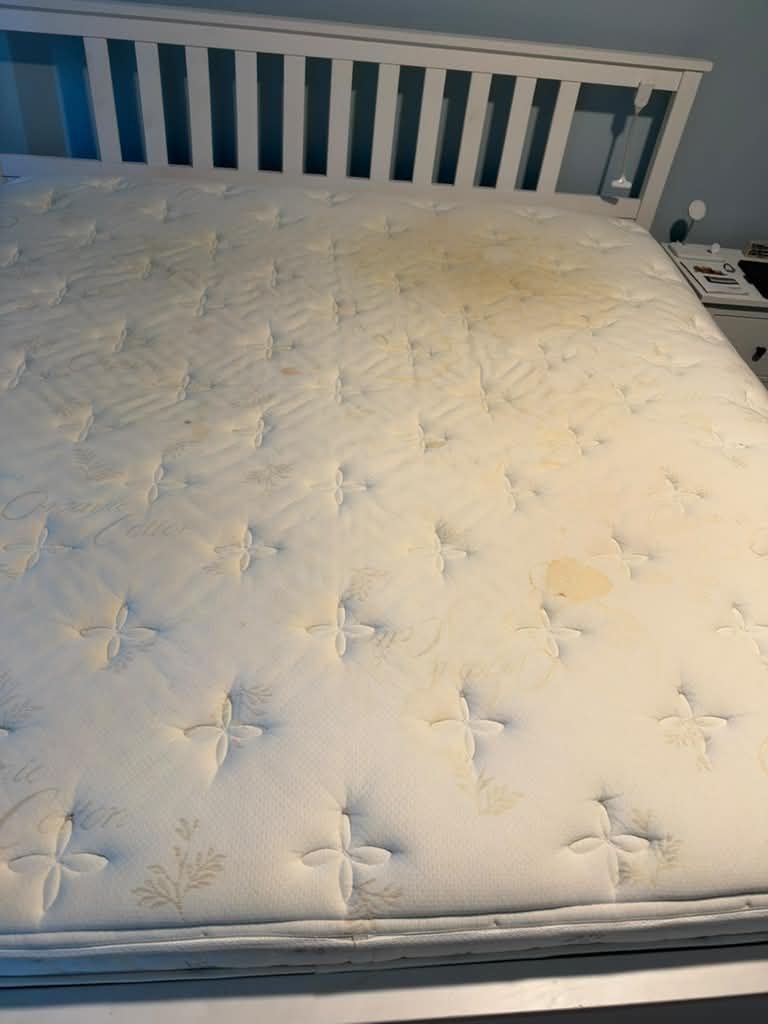 Stained mattress before professional mattress cleaning