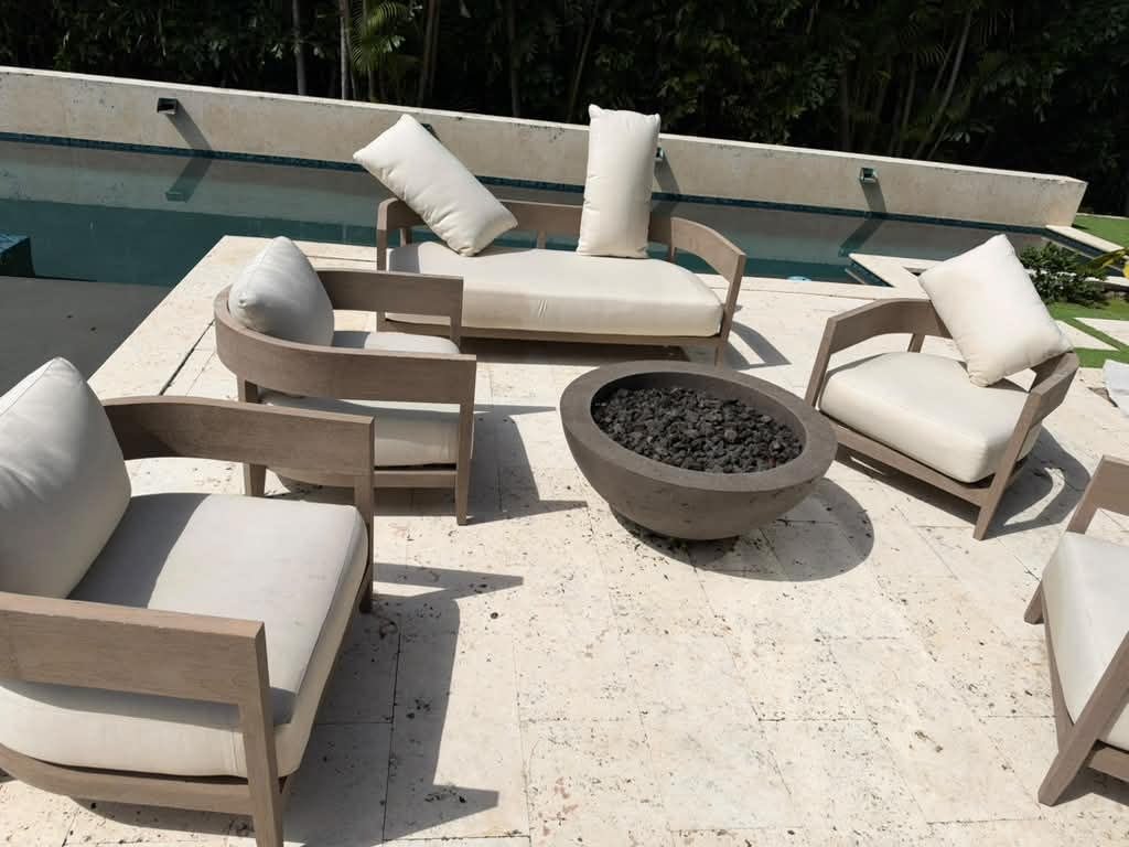 Outdoor patio furniture cushions cleaned by a pool in Miami