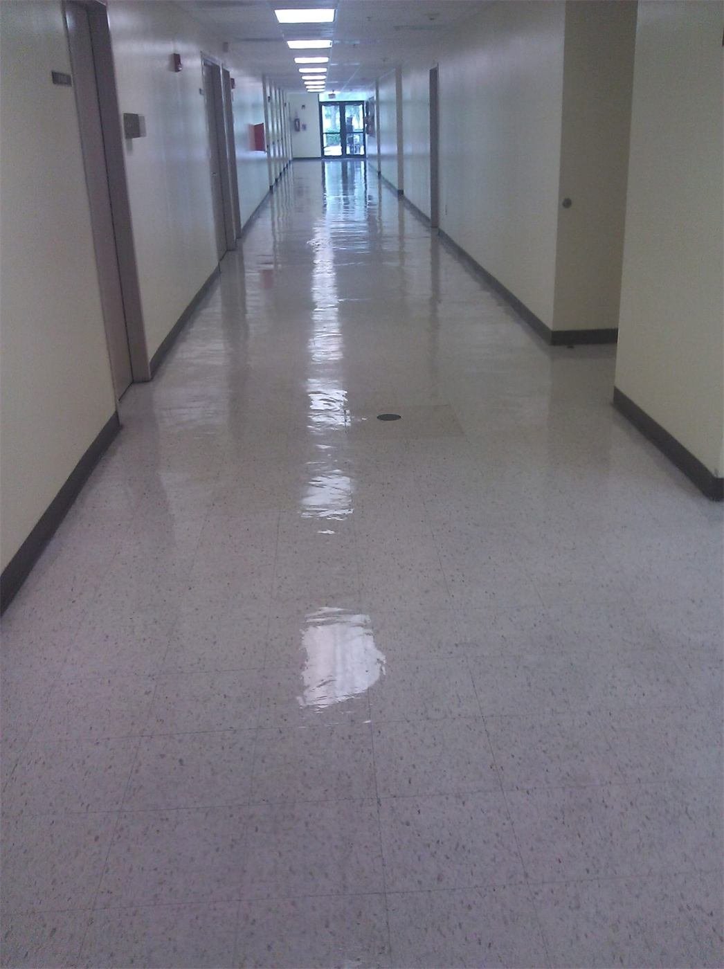Polished terrazzo hallway floor with a glossy finish in a Miami building